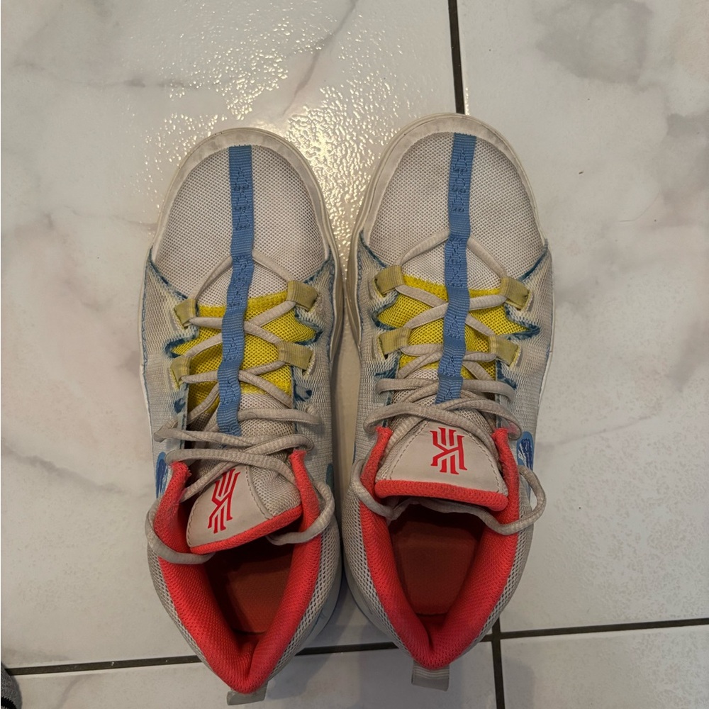 Vibrant Kirie Irving Kids Sneakers with Blue, Yellow, and Red Highlights